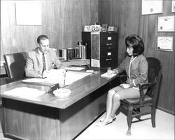 Attorney Edward Dermott dictating to unidentified secretary, Santa Rosa, California, July 11, 1966