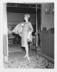 Model in evening dress in the "Dramatic Moods" fashion show in the Topaz Room, Santa Rosa, California, 1959