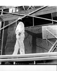 Applying Calaveras Plastic to exterior of the Santa Rosa Garden Apartments