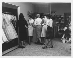 Girls of Conover School trying on clothes at Ceci's, Santa Rosa, California, 1960