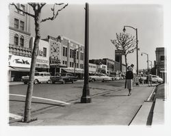 Sandy Perry walking in front of the Courthouse, Santa Rosa, California, 1959