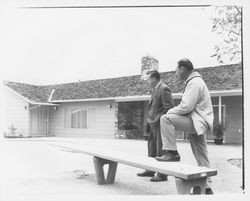 Lewis Meyers and unidentified man inspecting a Meyers built home, Santa Rosa, California, 1960