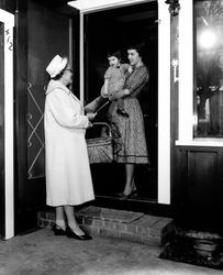 Welcome Wagon hostess greeting a newcomer, Santa Rosa, California, 1961