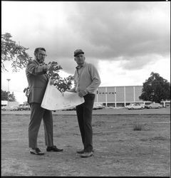 Hugh Codding talking to Sam Gordan at Coddingtown, Santa Rosa, California, March 17, 1963