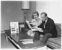 Looking at brochures and plans at Young America's Oak Lake Green subdivision, Petaluma, California, 1964