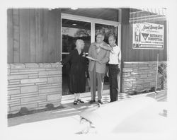 Melvin S. and Flora Ann Cobb with an unidentified man in front of Holiday Bowl, Santa Rosa, California, 1959