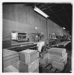 Worker stacking 2" x 4" fire-stop sections at Speedspace Corporation, 920 Shiloh Road, Windsor, California, 1971