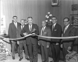 Congressman Don Clausen cutting the ribbon at grand opening of Summit Savings, Sebastopol, California, 1967