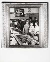 Exchange Bank customers inspecting a display case in the bank lobby, Santa Rosa, California, 1965