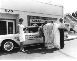 Miss Sonoma County 1961, Charlotte Townsend, picking up her dry cleaning at the Empire Economy Cleaners, Santa Rosa, California