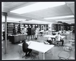 Mrs. Hahn, Librarian, assisting patrons of the Rohnert Park Library, Rohnert Park, California, 1968