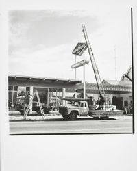 Santa Rosa Neon Lite Company erecting a sign for Downey Tire Company, Santa Rosa, California, 1971