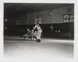 Skaters with scimitars in an Arabian Nights routine in the Skating Revue of 1957, Santa Rosa, California, April, 1957