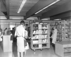 Interior views of North Bay Cooperative Library System headquarters building at dedication, Santa Rosa, California, 1967