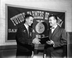 Jim Keegan presenting a plaque to Santa Rosa High School FFA member Bill Jacobs, Santa Rosa, California, 1963