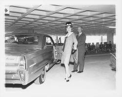 Mid-length herringbone-patterned dress modeled at a fashion show at dedication of parking garage at 3rd and D, Santa Rosa, California, 1964