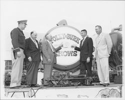 Dutch Flohr and four other men in front of sign for Foley & Burk Shows, Santa Rosa, California, 1958