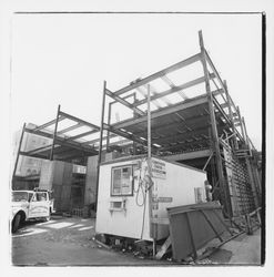 Christensen and Foster mobile office and girders of the new Exchange Bank building, 550 Fourth Street, Santa Rosa, California, 1971