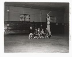 Skaters with scimitars in an Arabian Nights routine in the Skating Revue of 1957, Santa Rosa, California, April, 1957