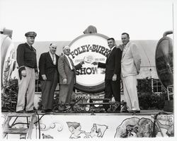 Dutch Flohr and four other men in front of sign for Foley & Burk Shows, Santa Rosa, California, 1958