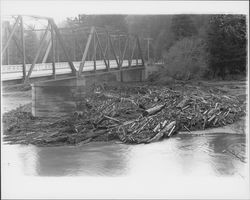 Logs and debris at a Russian River bridge after a flood, Guerneville, California(?), 1937