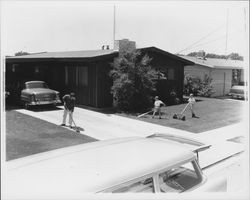 Peck family working in the yard, Santa Rosa, California, 1957