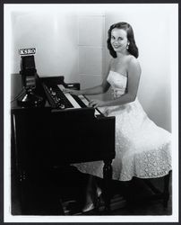 Diane Romero at the organ at KSRO, Santa Rosa, California, 1957