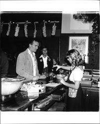 Pouring wine at the Sonoma Cheese Factory's 50th anniversary party, Sonoma, California, 1981