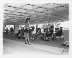Plaid skirt and jacket ensemble modeled at the fashion show at dedication of parking garage at 3rd and D, Santa Rosa, California, 1964