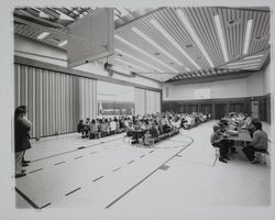 Children eating lunch in the multi-purpose room at Binkley School, Santa Rosa, California, 1972