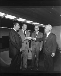 Cono di Pietro, Leo Nomellini, Donald Scott and John P. Long at grand opening of Bank of Sonoma County, Santa Rosa, California, March 19, 1973