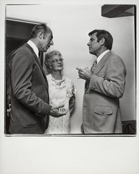 John Downey talking with two people at Empire Dental Clinic open house, Santa Rosa, California, 1971