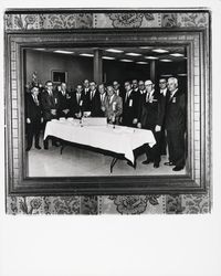 Exchange Bank officials cutting a cake in honor of the 75th anniversary of the bank, Santa Rosa, California, 1965