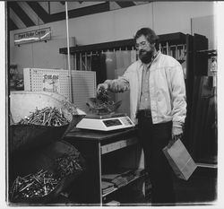 Weighing nails at Yaeger and Kirk, Santa Rosa, California, 1978