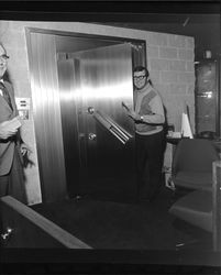 Shamus O'Grady entering vault of Bank of Sonoma County, Santa Rosa, California, March 19, 1973