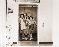 Four clowns in the elevator at Sears, Santa Rosa, California, 1980