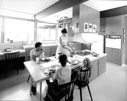 Rush family enjoying a meal in their kitchen, Santa Rosa , California, June, 1965