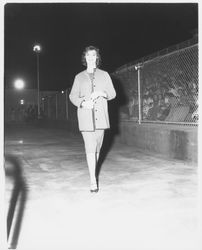 Jonelle Johnson, Miss Marysville-Yuba City, modeling a checked jacket and skirt ensemble in the Aqua Varieties fashion show at the Swim Center, Santa Rosa, California, 1959