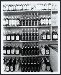 Store shelves holding bottles of Sebastiani and Gallo wines, Sonoma, California, 1960?