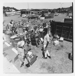 Glass sorting barrels and workers at the Recycling Center, Santa Rosa, California, 1971