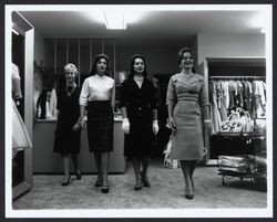 Girls of Conover School trying on clothes at Ceci's, Santa Rosa, California, 1960