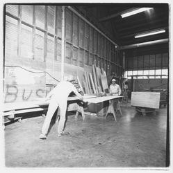 Workers trim sheets of plywood at Speedspace Corporation, 920 Shiloh Road, Windsor, California, 1971
