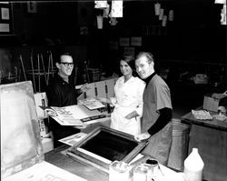 Lloyd Wasmuth, Linda Hullen and Patrick Gallagher preparing posters for classic film series sponsored by Artrium '67, Santa Rosa, California, November 21, 1966