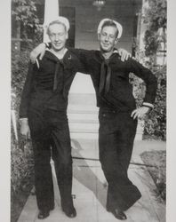 Sailors Charles Belden and Clarence B. Tauzer stand arm in arm in Santa Rosa, California, 1944