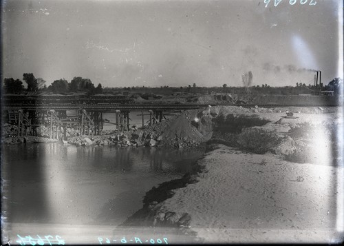 Closing the by pass after destruction of Rockwood gate at Mexican intake of C.D.Co. Colorado River. View shows the two lower trestles at left and dam across by-pass at right