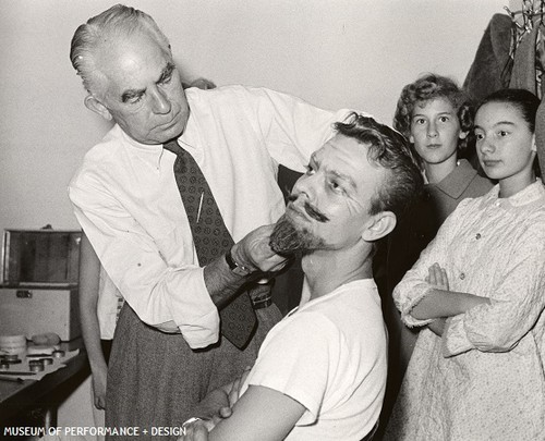 Dancer Julien Herrin working with make-up artist Everett Mason preparing for Christensen's Nutcracker, circa 1950s-1960s