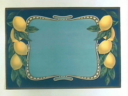 Stock label: gold lined text panel between branches of lemons and leaves