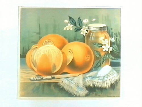 Stock label: oranges, blossoms, knife, and jar of preserves on towel