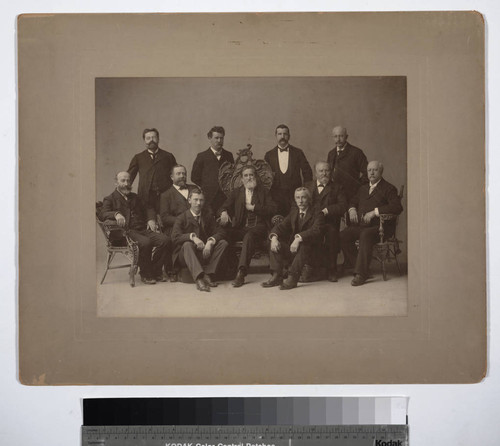 [Group portrait of Prang surrounded by 10 men]