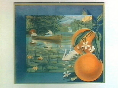 Stock label: man and woman in rowboat on lily pond with swans and waterfall